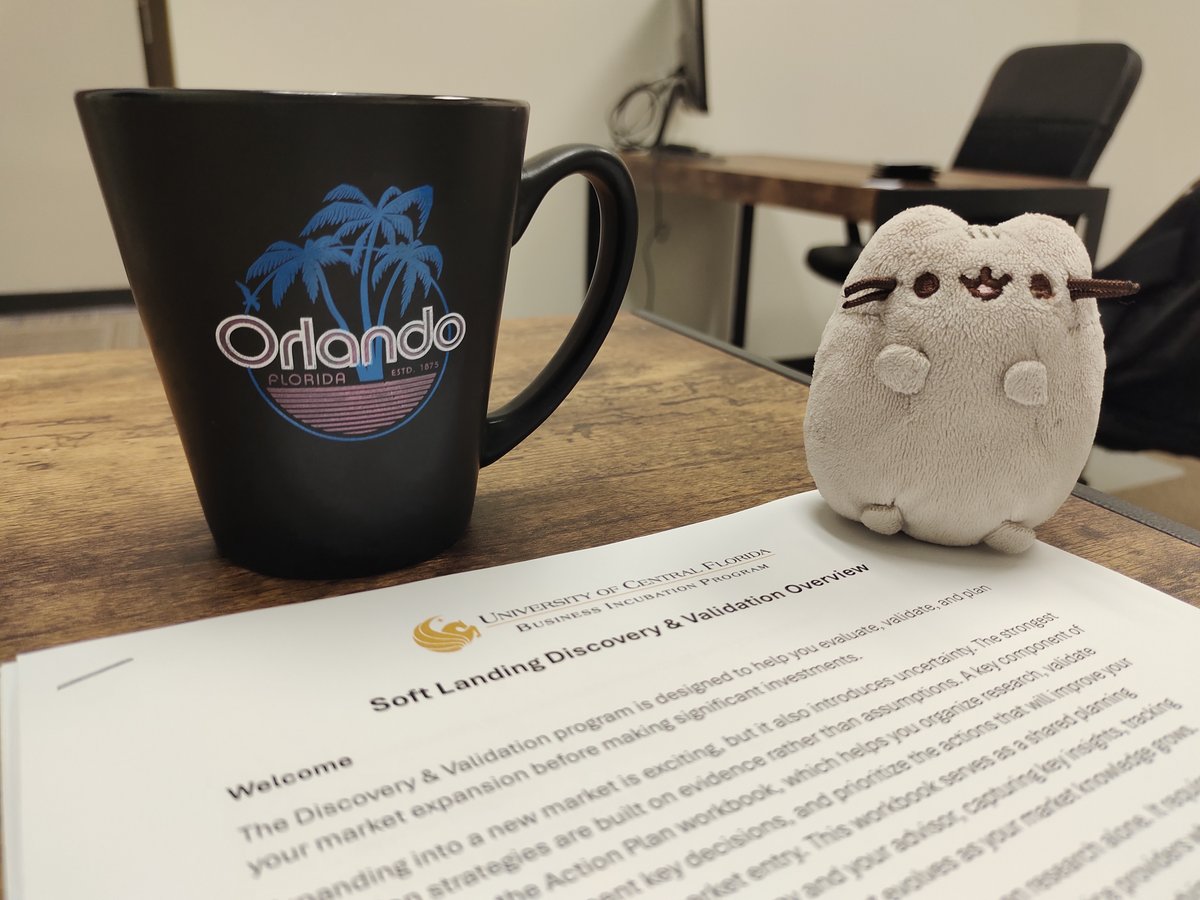 Orlando Mug and Pusheen Plush on UCF Business Document